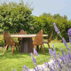 Table de jardin ronde en corten bruni et bois de mélèze brossé à l'eau SPICA - TrackDesign par Alessandra Savio